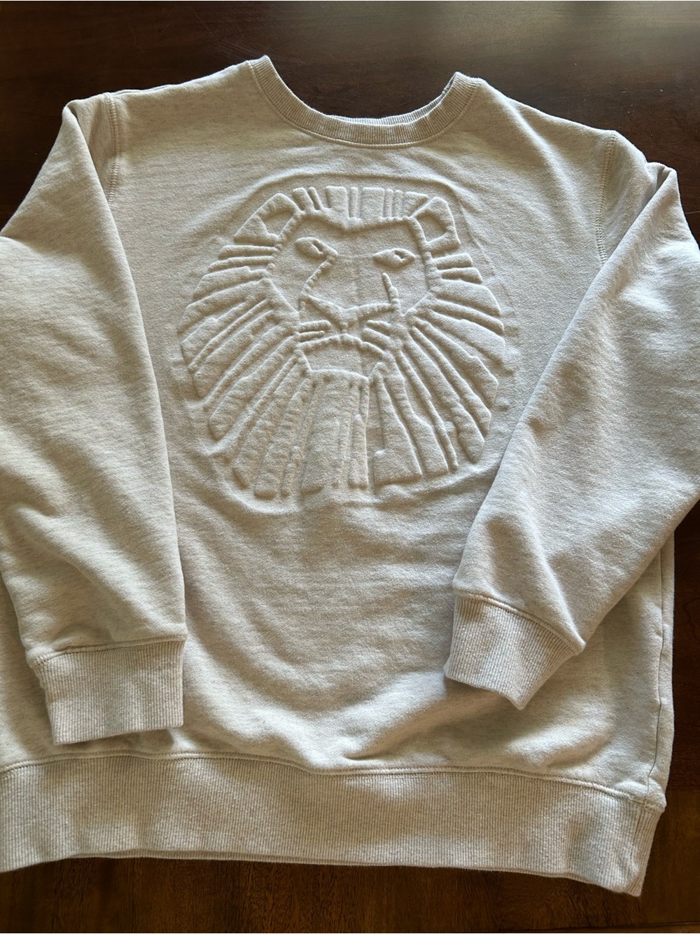 Disney Lion King Women's  Cream Crewneck Sweatshirt with Embossed Lion